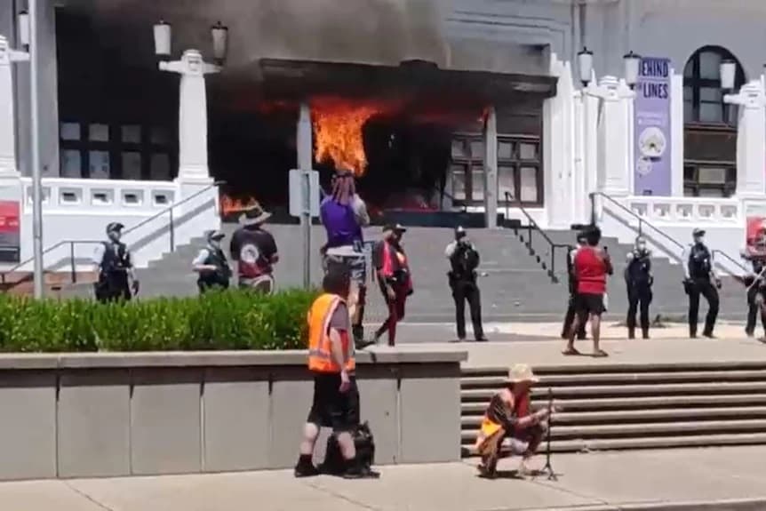Old Parliament House’s front door set on fire a second time as protests in Canberra continue